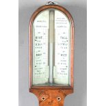 A late Victorian walnut stick barometer, the arched ivorine dial with Vernier scale and inscribed 'A