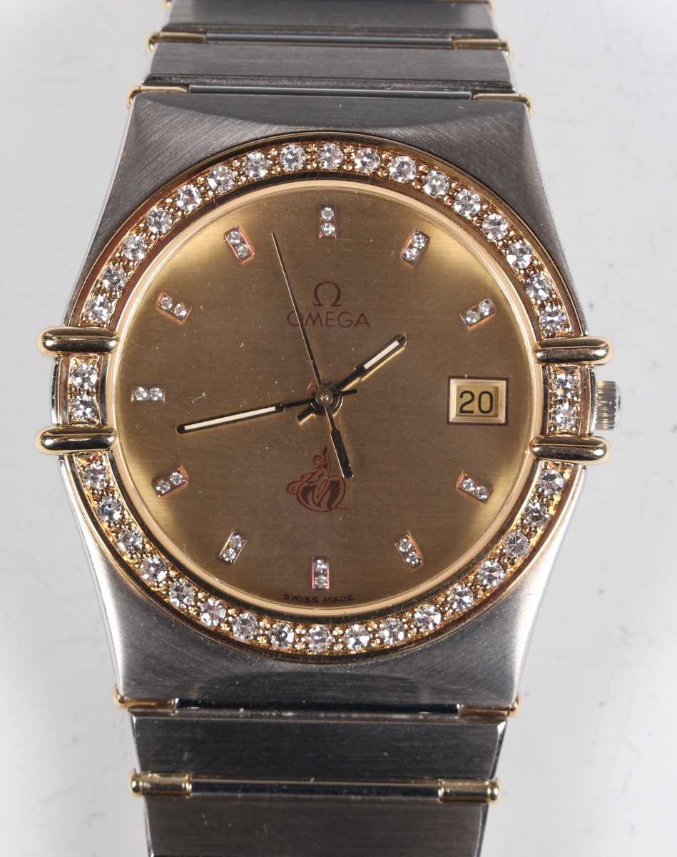 An Omega Quartz steel and gold gentleman's bracelet wristwatch, the signed brushed gilt dial with