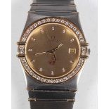 An Omega Quartz steel and gold gentleman's bracelet wristwatch, the signed brushed gilt dial with