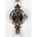 A Pequignet Quartz steel and gilt lady’s bracelet wristwatch, the gilt outer bezel with Roman