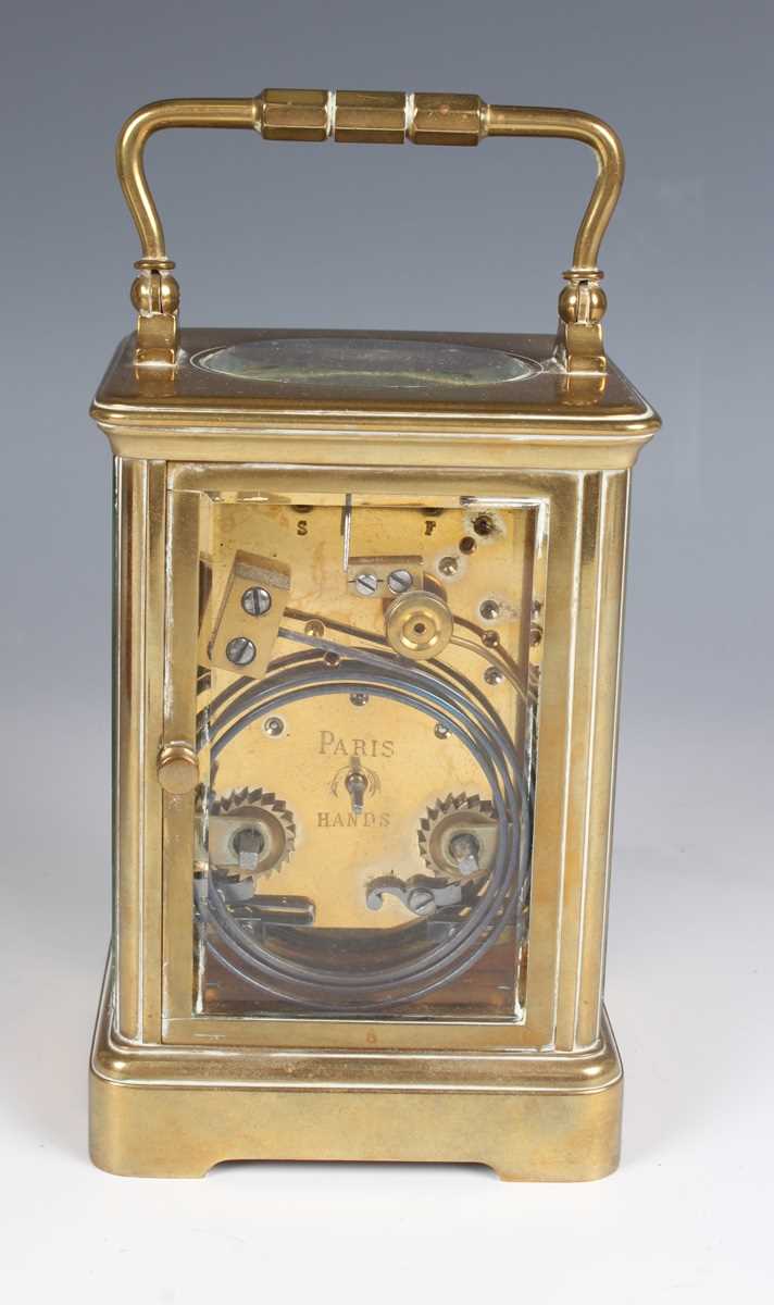 A late 19th century French brass corniche cased carriage clock with eight day movement striking on a - Image 5 of 8