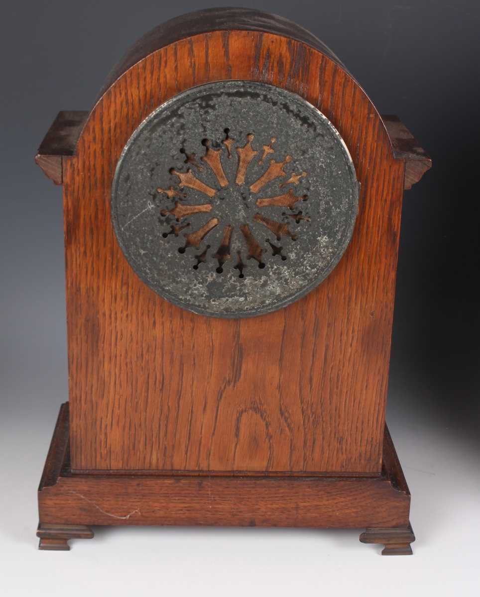 An early 20th century oak mantel clock with eight day movement striking on a gong, the white - Image 5 of 27