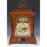 An early 20th century oak cased bracket clock with eight day movement striking on two gongs, the