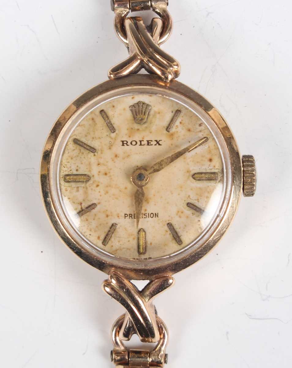 A Rolex 9ct gold circular cased lady's wristwatch with signed and jewelled movement, the signed dial