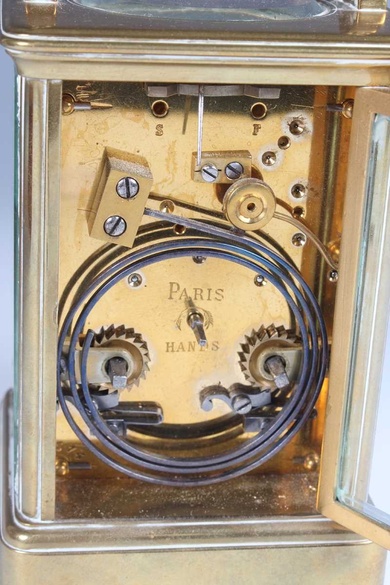 A late 19th century French brass corniche cased carriage clock with eight day movement striking on a - Image 3 of 8