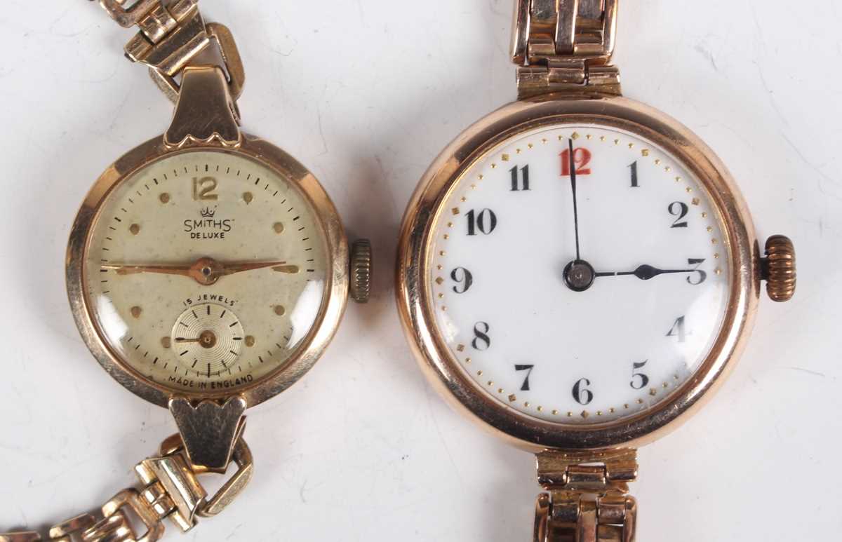A 9ct gold circular cased lady's wristwatch, the enamelled dial with Arabic numerals, on a sprung