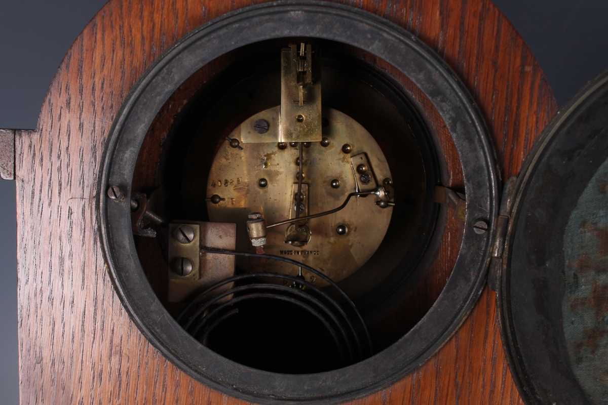 An early 20th century oak mantel clock with eight day movement striking on a gong, the white - Image 4 of 27