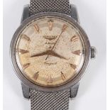 A Longines Automatic Conquest stainless steel circular cased gentleman's wristwatch, circa 1957, the