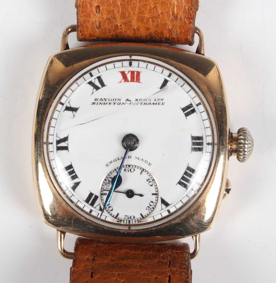 A 9ct gold square cushion cased gentleman's wristwatch with unsigned gilt movement, the enamelled