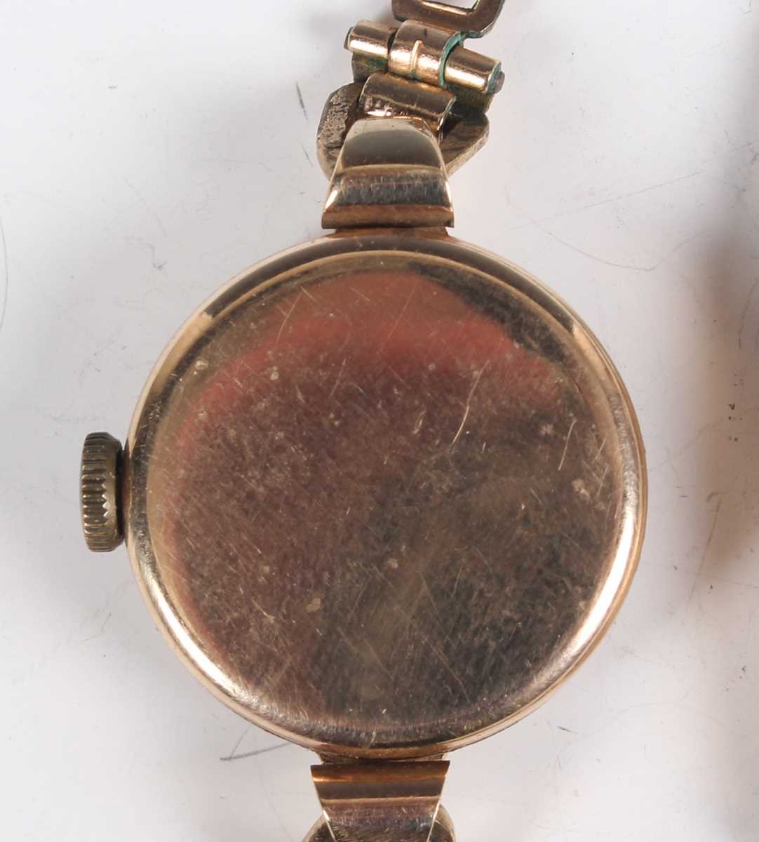 A 9ct gold circular cased lady's wristwatch, the enamelled dial with Arabic numerals, on a sprung - Image 5 of 10