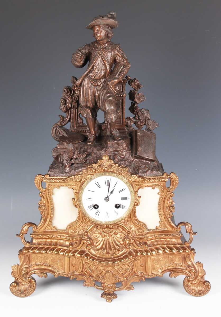 A mid to late 19th century French brown patinated and gilt spelter mantel clock, the eight day