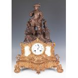 A mid to late 19th century French brown patinated and gilt spelter mantel clock, the eight day