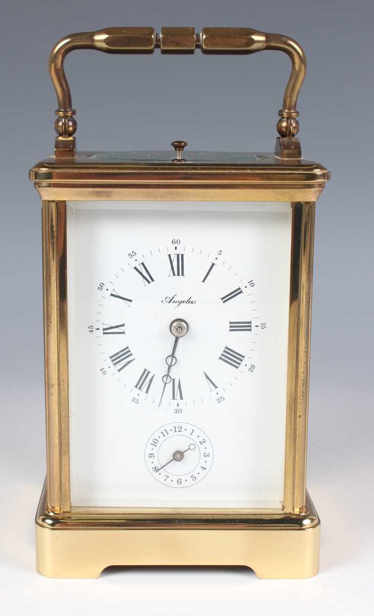 A late 20th century French lacquered brass corniche cased carriage alarm clock by L'Epée, the