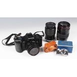 An Olympus OM101 Power Focus camera with Olympus 35-70mm 1:3.5-4.5 zoom lens, together with a