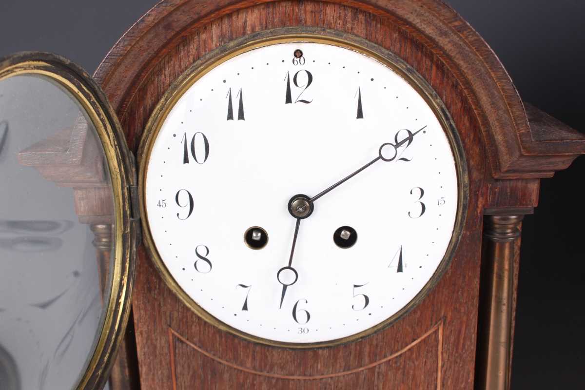 An early 20th century oak mantel clock with eight day movement striking on a gong, the white - Image 3 of 27