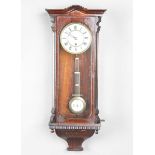 A late 19th century simulated rosewood cased Vienna style wall timepiece with single train movement,