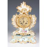 A mid-19th century French Jacob Petit Paris porcelain cased mantel clock and matching stand, the
