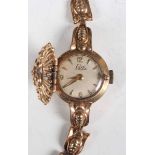 An Elco 9ct gold lady's bracelet wristwatch with pierced hinged cover to the dial, total weight 16.