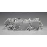 A Baccarat clear glass model of a panther lying down, engraved mark to side edge, length 26cm.