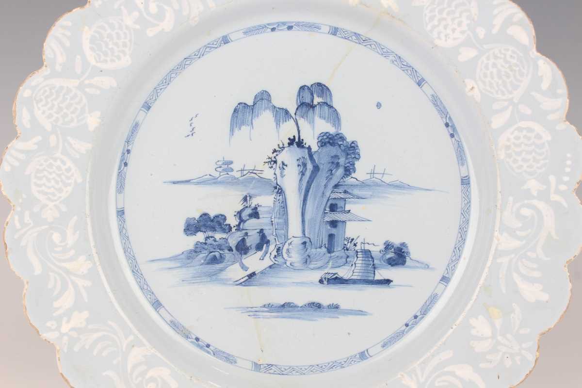 A manganese powdered ground delft dish, Bristol or Wincanton, circa 1740, painted in blue with a - Image 14 of 21