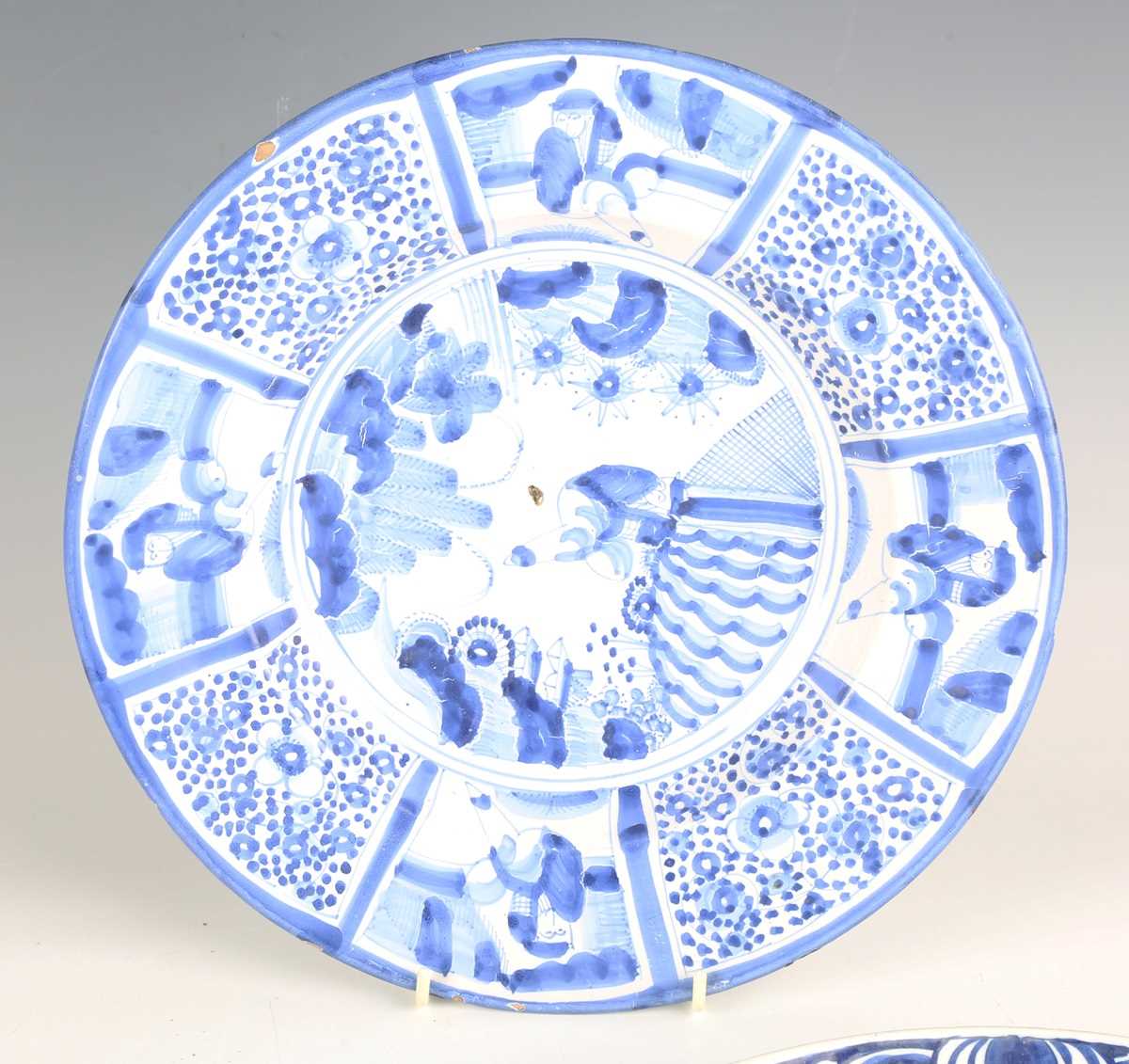 A set of four Dutch delft plates, late18th/19th century, each painted in blue with a central 'tea - Image 17 of 19