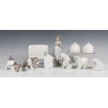 Three Lladro polar bears, two Lladro puppies, the Lladro Collector's Society figure Summer Stroll,