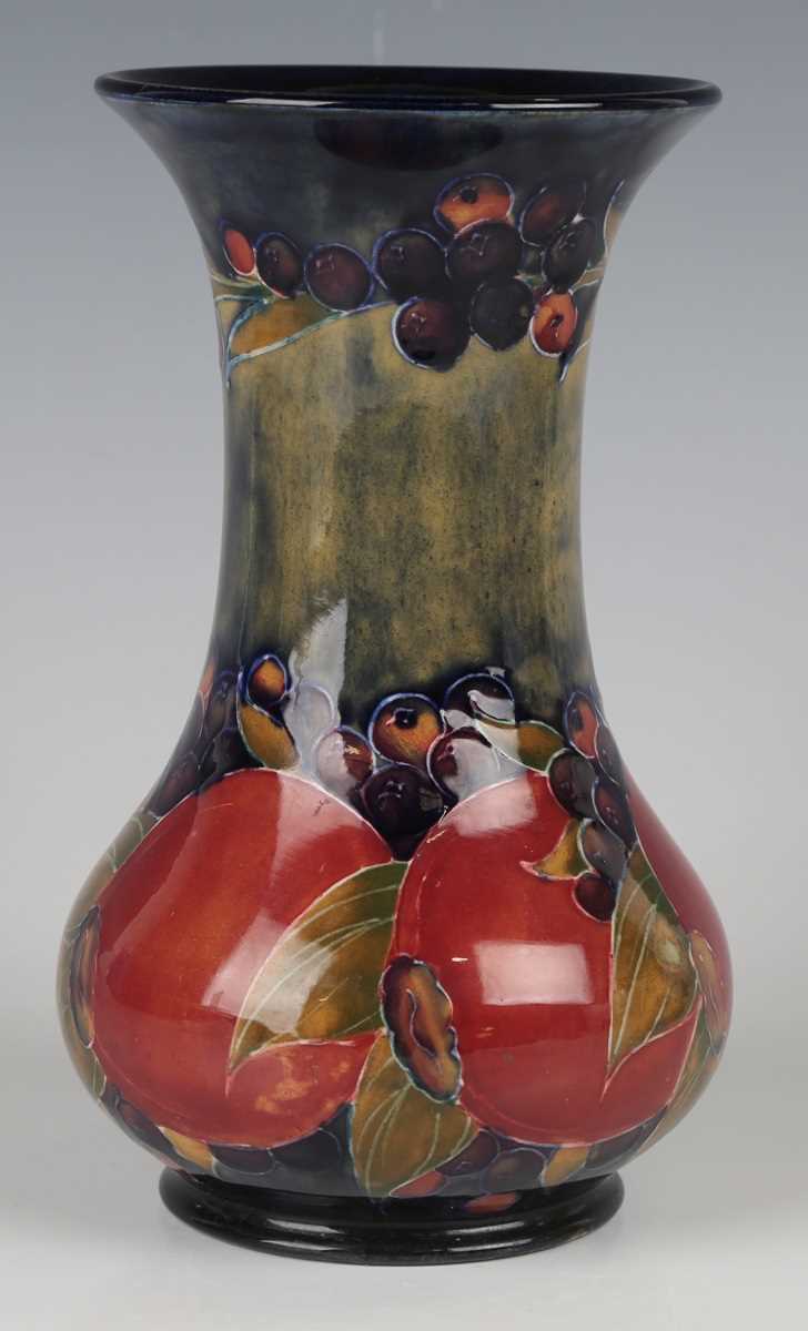 A Moorcroft Pomegranate pattern vase, circa 1920, impressed Cobridge factory mark to base with green