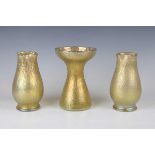 A pair of Loetz Candia Mimosa iridescent glass vases, early 20th century, the swollen bodies with