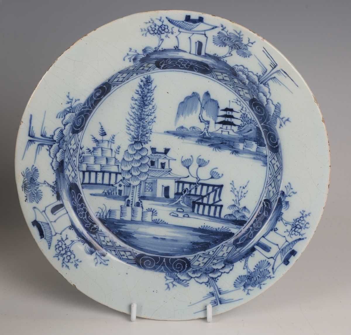 A matched pair of English delft plates, probably London, 1780s, painted in blue with a chinoiserie - Image 2 of 7