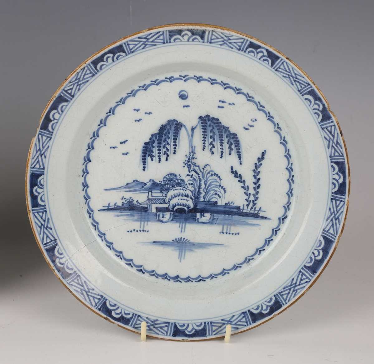 A matched pair of English delft plates, probably London, 1780s, painted in blue with a chinoiserie - Image 4 of 7