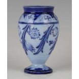 A small Macintyre Moorcroft Florian Ware vase, circa 1898, decorated in shades of blue with