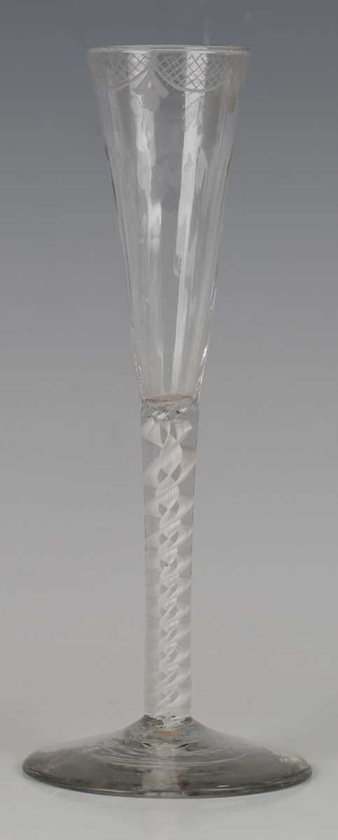 A double series opaque twist stem ratafia glass or flute, circa 1770, the slender drawn bowl moulded