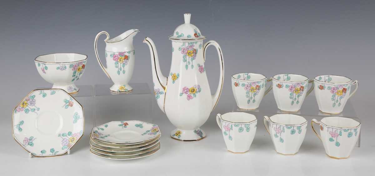 A Royal Doulton Art Deco coffee set, circa 1930, decorated with nasturtium flowers, comprising