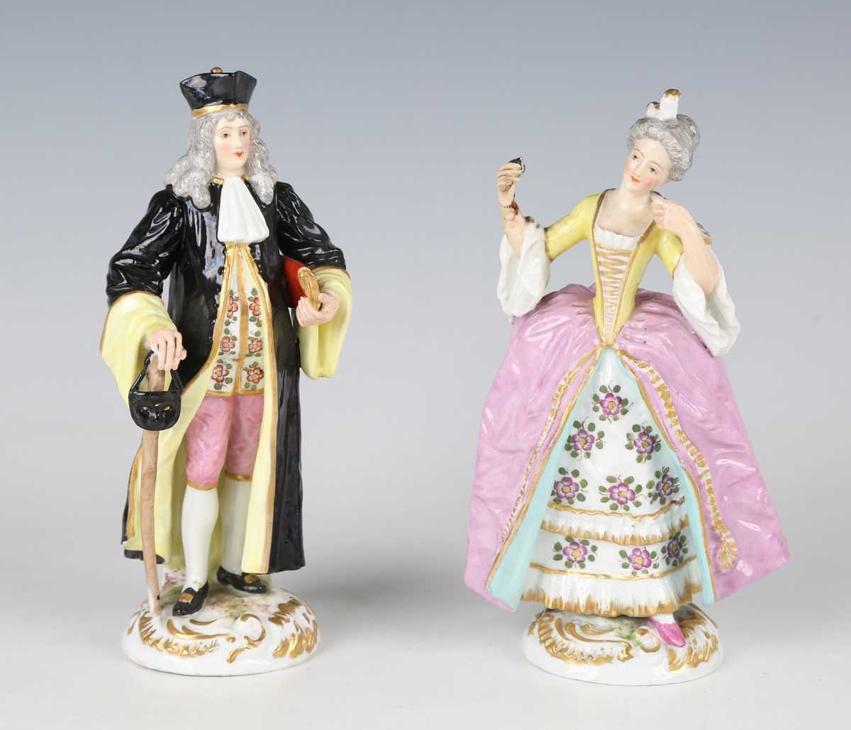 A pair of Paris porcelain Commedia dell'Arte style figures, early 20th century, he wearing a black