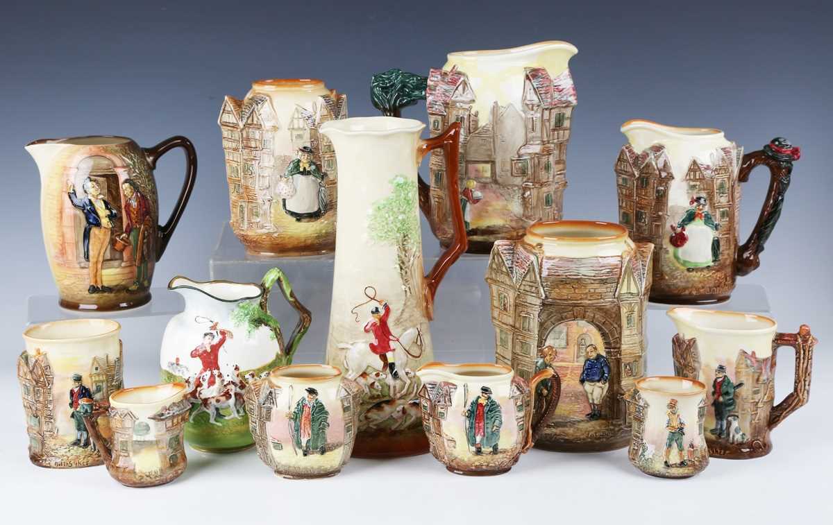A large mixed group of Royal Doulton Dickens related relief moulded series ware, comprising six