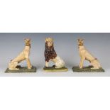 A pair of Continental pottery models of greyhounds, probably Brussels, late 18th century, the seated