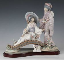 A Lladro figure group Springtime In Japan, No. 1445, height 24cm, with stand (standing figure