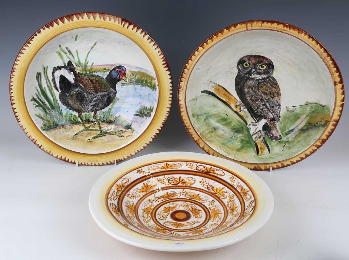 Two Italian pottery circular bowls, the first painted with a moorhen, the second an owl, each 35.5cm