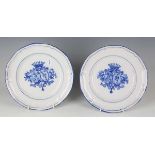 A pair of St. Clement Galle Nancy faience plates, late 19th/20th century, painted in blue with a