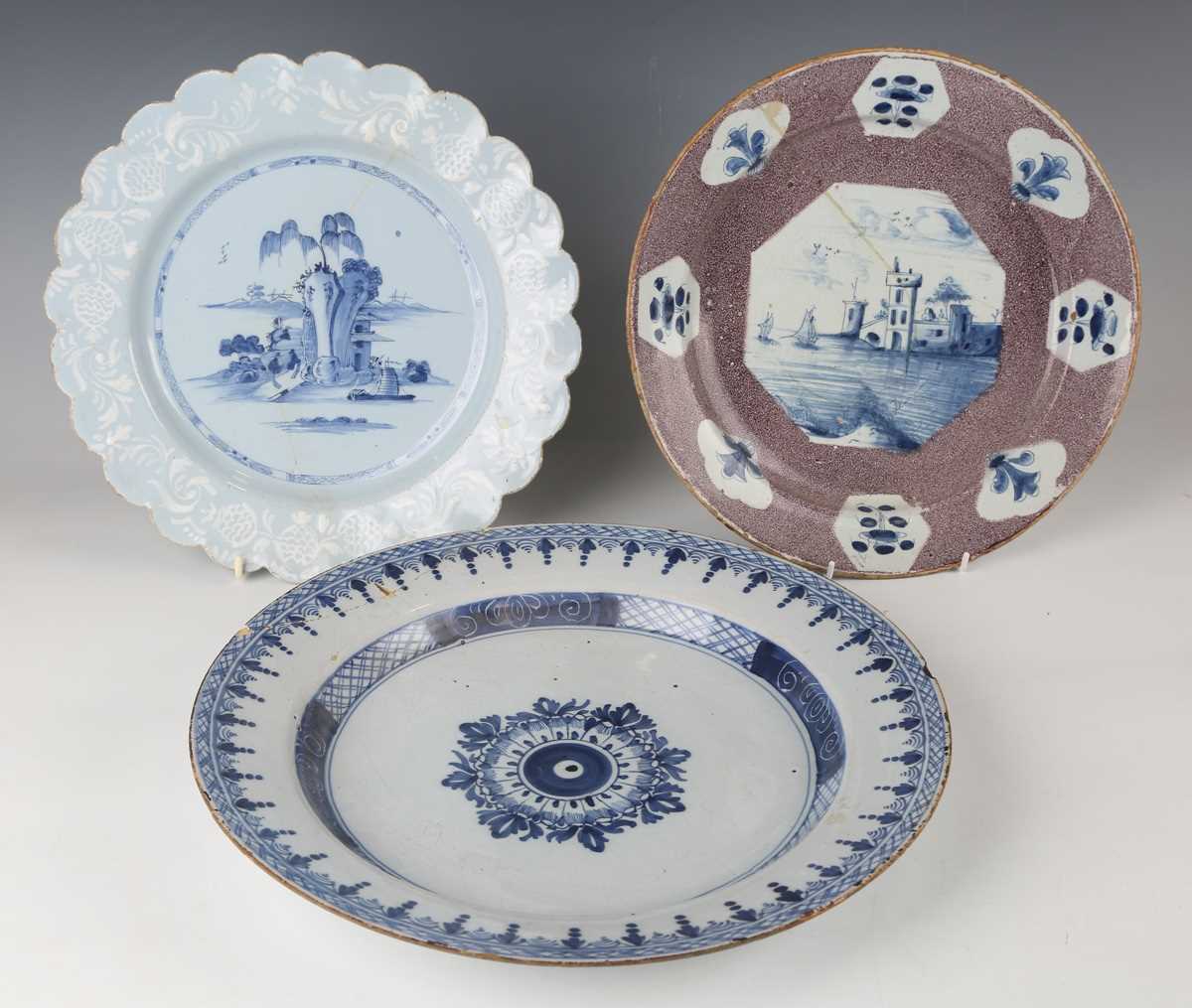 A manganese powdered ground delft dish, Bristol or Wincanton, circa 1740, painted in blue with a