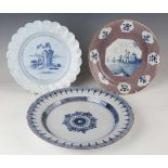 A manganese powdered ground delft dish, Bristol or Wincanton, circa 1740, painted in blue with a