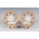 A pair of Royal Worcester reticulated cups and saucers, circa 1876, of double-walled construction,