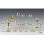 Three Theresienthal enamelled wine glasses, circa 1907, each with a green and yellow foliate garland