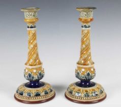 A pair of Doulton Lambeth candlesticks, late 19th century, decorated by Emily Partington,