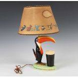 A Carlton Ware Guinness Toucan advertising lampbase, modelled with a toucan standing beside a pint