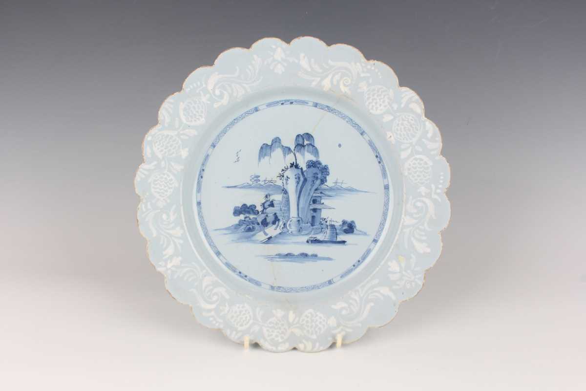 A manganese powdered ground delft dish, Bristol or Wincanton, circa 1740, painted in blue with a - Image 13 of 21