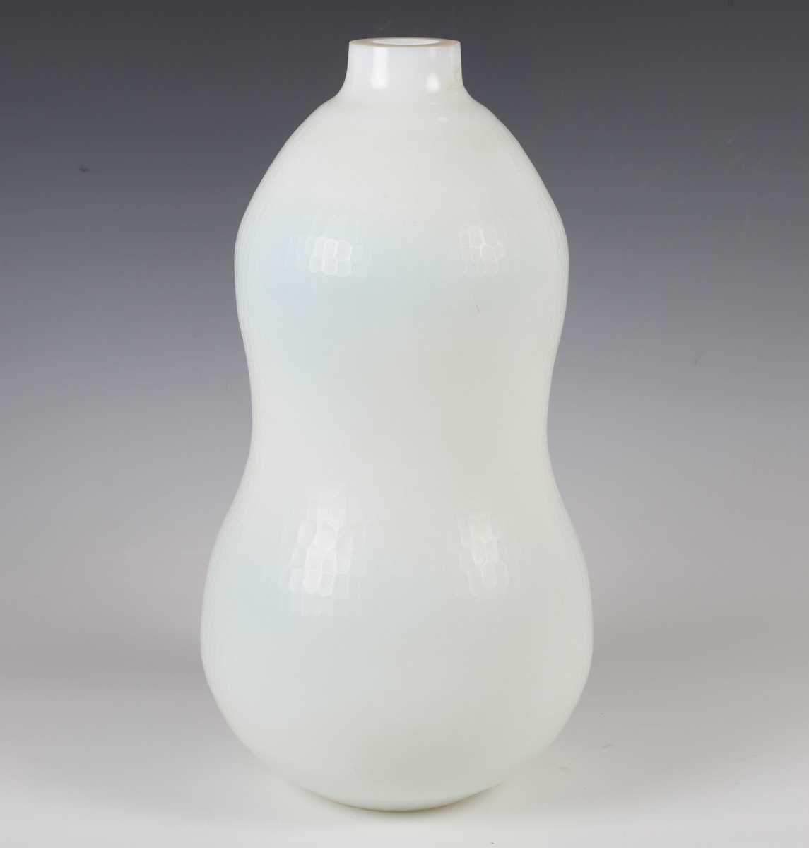 A large Murano battuto glass vase, in the manner of Carlo Scarpa, the milky white body of gourd