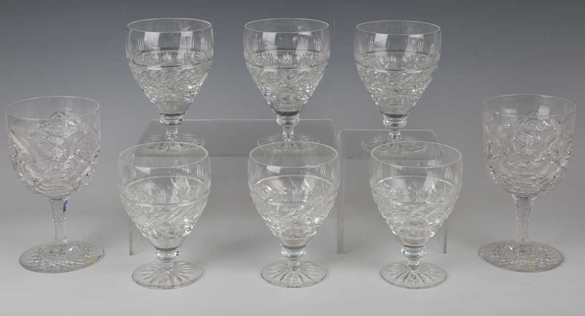 A set of seven hollow stem wine glasses, late 19th/early 20th century, the rounded funnel bowls - Image 4 of 5
