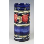 A Moorcroft Banded Pomegranate pattern cylindrical vase, 1920s, with cobalt blue ground, impressed