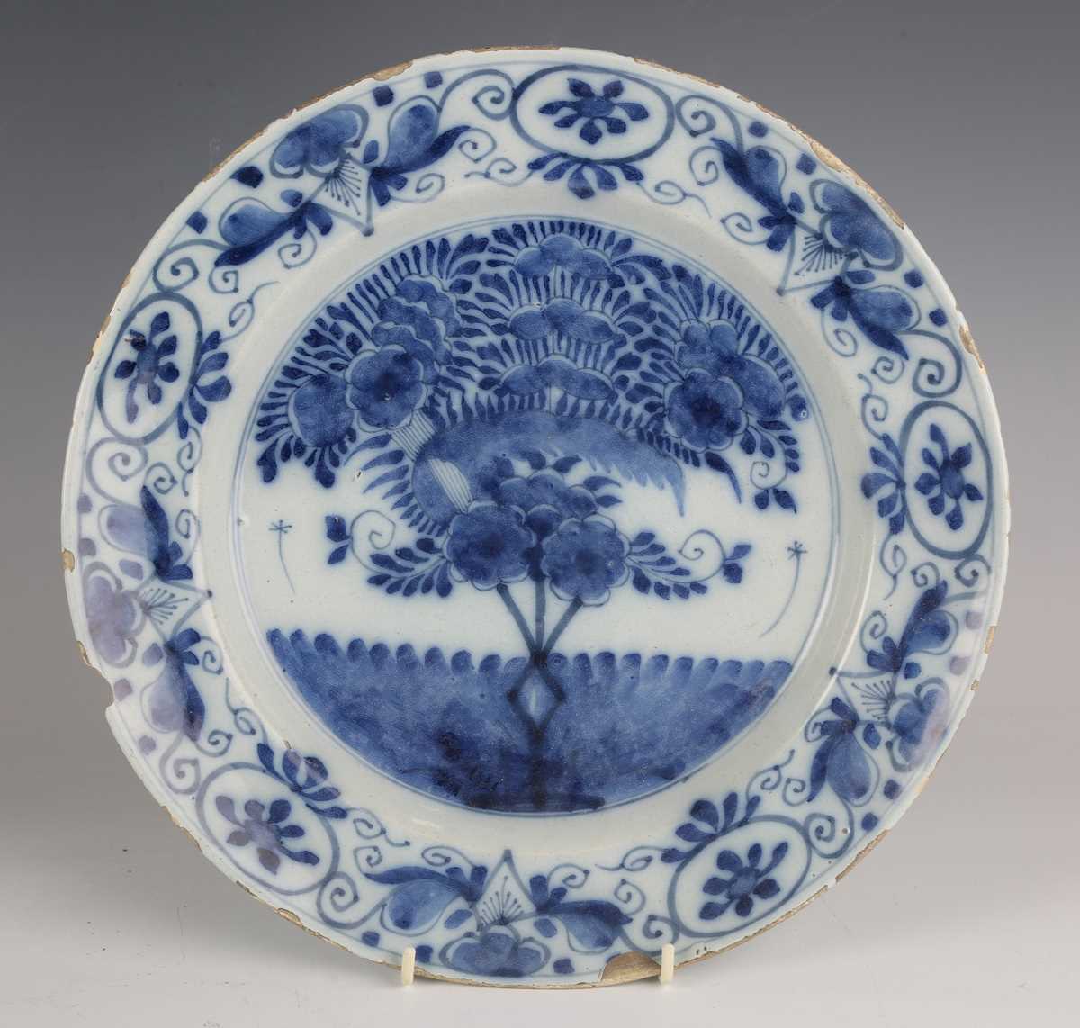 A set of four Dutch delft plates, late18th/19th century, each painted in blue with a central 'tea - Image 2 of 19